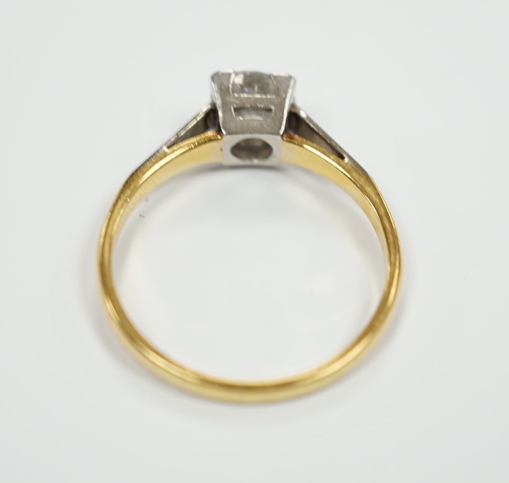 An 18ct, plat. and solitaire diamond ring, size O, gross weight 2.7 grams, the stone measuring 5.7mm in diameter.